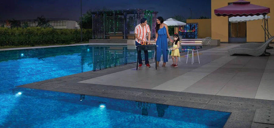 Swimming pool with cabanas at the Joyville Howrah clubhouse