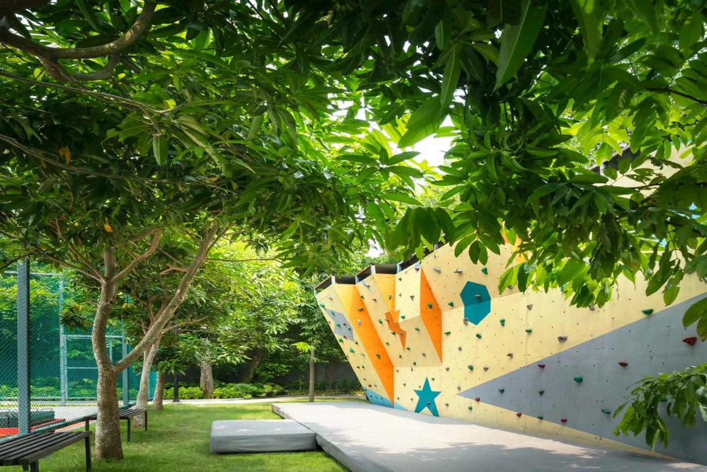 Rock climbing wall in the gardens at One10, New Town